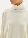 curved hem turtleneck knit